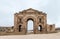 Hadrian`s Gate in the ruins of the great Roman city of Jerash - Gerasa, destroyed by an earthquake in 749 AD, located in Jerash ci