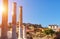 Hadrian`s Library in sunlight, Acropolis in distance, Athens, Greece. It are famous landmarks of Athens. Urban sunny landscape of