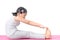 Haealthy asian kid exercise on yoga mat isolated