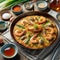 Haemul Pajeon, A savory pancake made with a variety of seafood, green onions, and batter, pan-fried until crispy