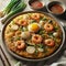Haemul Pajeon, A savory pancake made with a variety of seafood, green onions, and batter, pan-fried until crispy
