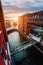 HafenCity. Bridge over canal and red brick buildings in the old warehouse district Speicherstadt in Hamburg in golden