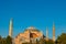 Hagia Sophia or Ayasofya Mosque at sunset with a seagull on the dome