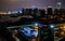 Haikou cityscape with rooftop terrace and view on the coastal city bay and skyline illuminated at night Haikou Hainan China