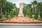 Haikou People`s Park view with trees and monument with people in Haikou Hainan China