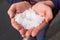 Hail in caucasian woman hands after hailstorm
