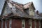 hail-damaged roof with visible dents and cracks