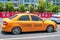 Hainan Island, Sanya, China - May 18, 2019: Taxi. Chinese yellow taxi on the street of Sanya