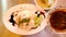Hainanese chicken rice set served with soup top view Asian food
