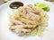 Hainanese chicken rice or Steamed chicken with rice