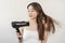 Hair Dryer, beautiful happy, asian young woman, girl hand in using, holding hairdryer to dry, blowing blonde long straight after