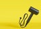 Hair dryer on yellow background with copy space. Empty space for text, advertising. Professional hair style tool