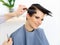 Hair. Hairdresser doing Hairstyle. Beauty Model Woman. Haircut