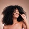 Hair in hands, beauty and black woman with smile on brown background for wellness, shine and natural glow. Salon, luxury