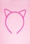 Hair hoop in shape of cat ears on soft pink background