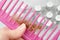 hair loss problem. Bottles with medicine, hairbrush and hair bun. alternative treatments medication bottles and comb on gray