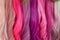Hair samples of different colors palette. Different hair bright rich tint colors - pink, crimson, orange. Various hair colors set