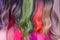 Hair samples of different colors palette. Different hair bright rich tint colors - pink, green, crimson, orange. Various hair