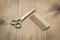 Hairbrushes, sprayer and a scissors on a wooden board, barbershop concept