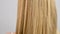 Haircare. Beautiful healthy straight hair. Woman moves blonde long hair