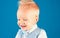 Haircut that is easy to manage. Boy child with stylish blond hair. Healthy haircare tips for kids. Little child with