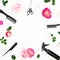 Hairdresser beauty concept with spray, scissors, combs and roses flowers on white background with copy space. Flat lay, top view