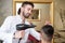 Hairdresser Blow Dry Man\'s Hair In Shop