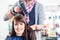 Hairdresser blow dry woman hair