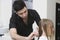 Hairdresser Combing Client\'s Hair Before Haircut At Parlor