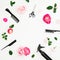Hairdresser concept with spray, scissors, combs and pink roses flowers on white background. Flat lay, top view
