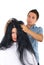 Hairdresser with customer woman with long hair
