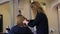 Hairdresser cutting hair salon