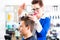 Hairdresser cutting man hair in barbershop
