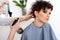 Hairdresser doing Hairstyle. Brunette with Short Hair in Salon