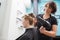 Hairdresser drying a customers hair