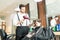 Hairdresser Drying Hair Of Male Child In Barber Shop