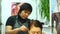 Hairdresser haircut woman in the salon