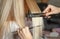 Hairdresser hands straightens client`s hair