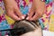 Hairdresser hands weaving a dreadlocks