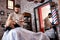 Hairdresser shaves man`s beard