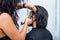 Hairdresser shaving hair to her handsome client, Barber at work in barbershop