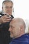 Hairdresser Shaving Male Customer\'s Head