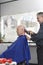 Hairdresser Shaving Man\'s Head With Electric Razor