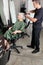 Hairdresser Straightening Senior Woman\'s Hair