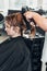 Hairdresser styling womans hair