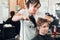 Hairdresser styling womans hair