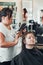 Hairdresser styling womans hair