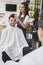 Hairdresser using comb at work