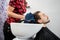 Hairdresser Wiping Male Customer\'s Hair In Salon