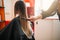 Hairdresser works with spray, female hairdressing